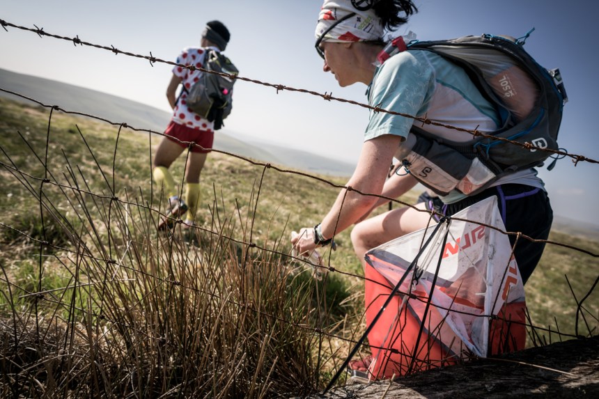 2 Carol Morgan ticks off another check point on day four of the Berghaus Dragon's Back Race - photo Ciancorless.com
