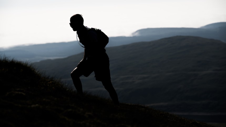 7 A runner in silhouette on day three of the Berghaus Dragon's Back Race - photo Ciancorless.com